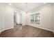 Inviting dining room with hardwood floors, a stylish chandelier, and ample natural light at 1026 Cagle Creek Overlook, Canton, GA 30115