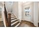 Welcoming entryway with hardwood floors, wood staircase, and a view to the outside at 1026 Cagle Creek Overlook, Canton, GA 30115