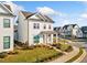 Charming two-story white home with well-maintained landscaping and a covered front porch at 1026 Cagle Creek Overlook, Canton, GA 30115