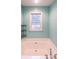 Clean bathroom featuring a large soaking tub, window, and sleek fixtures at 381 Mount Moriah Rd, Auburn, GA 30011