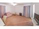 Spacious bedroom with charming pink accents, unique furniture, and ample natural light at 381 Mount Moriah Rd, Auburn, GA 30011