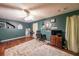Comfortable bedroom with hardwood floors, an organized desk, and cozy decor at 381 Mount Moriah Rd, Auburn, GA 30011