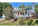 Charming home with a covered porch, green roof, beautiful yard and a well maintained exterior at 381 Mount Moriah Rd, Auburn, GA 30011