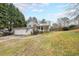 Charming home with a well-maintained lawn, garage, and welcoming front porch at 381 Mount Moriah Rd, Auburn, GA 30011
