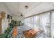 Relaxing sunroom with patterned floors, plants, and curtains for an airy feel at 381 Mount Moriah Rd, Auburn, GA 30011