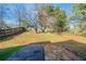 Large backyard with a patio and mature trees at 540 Lakecourt Dr, Mcdonough, GA 30253