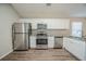 Modern kitchen with stainless steel appliances and granite countertops at 540 Lakecourt Dr, Mcdonough, GA 30253