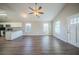 Open living space with kitchen view and wood-look floors at 540 Lakecourt Dr, Mcdonough, GA 30253