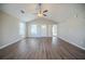 Spacious living room with vaulted ceiling and wood-look floors at 540 Lakecourt Dr, Mcdonough, GA 30253