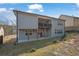 Multi-story home with a balcony and walk-out basement overlooking a modest yard at 1202 Ida Woods Ln, Lawrenceville, GA 30045