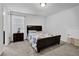 Bedroom offers comfort with a large window and neutral carpet at 1202 Ida Woods Ln, Lawrenceville, GA 30045