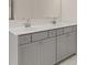 Double vanity with gray cabinets and white countertop at 13550 Whitman Se Ln, Covington, GA 30014