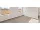 Well-lit bedroom with two windows and door at 13550 Whitman Se Ln, Covington, GA 30014