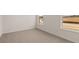Simple bedroom with carpet and large windows at 13550 Whitman Se Ln, Covington, GA 30014