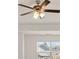 Modern ceiling fan with light kit in a bright room at 13550 Whitman Se Ln, Covington, GA 30014