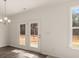 Dining area with access to backyard through french doors at 13550 Whitman Se Ln, Covington, GA 30014