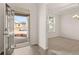 Open entryway with view into dining and living areas at 13550 Whitman Se Ln, Covington, GA 30014