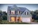 Two-story house with gray siding, stone accents, and a two-car garage at 13550 Whitman Se Ln, Covington, GA 30014