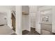 Hallway with staircase, coat closet, and access to other rooms at 13550 Whitman Se Ln, Covington, GA 30014