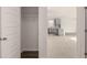 Hallway with view of kitchen and closet at 13550 Whitman Se Ln, Covington, GA 30014