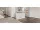 Open concept kitchen and dining area with gray cabinets and island at 13550 Whitman Se Ln, Covington, GA 30014