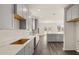 Modern kitchen with gray cabinets, quartz countertops, and hardwood floors at 13550 Whitman Se Ln, Covington, GA 30014