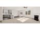 Open concept kitchen and living area with gray cabinets and island at 13550 Whitman Se Ln, Covington, GA 30014