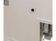 A bright laundry room with built-in shelving and modern vent at 13550 Whitman Se Ln, Covington, GA 30014