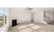 Spacious living room with fireplace and carpet flooring at 13550 Whitman Se Ln, Covington, GA 30014