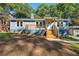 Charming blue house with a wood deck and landscaped yard at 164 Chicamauga Sw Ave, Atlanta, GA 30314