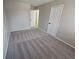 Well-lit bedroom with neutral walls and carpeted floors at 1037 Forest Path, Stone Mountain, GA 30088