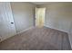 Simple bedroom with neutral carpeting and doors at 1037 Forest Path, Stone Mountain, GA 30088