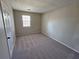 Spacious bedroom with neutral walls and carpeted floors at 1037 Forest Path, Stone Mountain, GA 30088