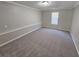 Spacious bedroom with neutral carpeting and walls at 1037 Forest Path, Stone Mountain, GA 30088