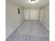 Spacious bonus room with neutral carpeting and ample closet space at 1037 Forest Path, Stone Mountain, GA 30088