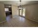 Bright dining room with tile floor and access to patio at 1037 Forest Path, Stone Mountain, GA 30088