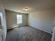 Bedroom with neutral paint, carpet and standard door at 262 Depot Landing Rd # 51, Auburn, GA 30011