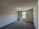 Standard bedroom featuring a window for natural light, neutral paint and carpet at 262 Depot Landing Rd # 51, Auburn, GA 30011