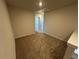 Bedroom with neutral paint, carpet and standard door at 262 Depot Landing Rd # 51, Auburn, GA 30011