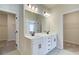 Double vanity bathroom with walk-in closets at 262 Depot Landing Rd, Auburn, GA 30011