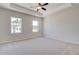 Main bedroom with carpeted floors and tray ceiling at 262 Depot Landing Rd # 51, Auburn, GA 30011