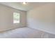 Bright bedroom with neutral walls and carpeting at 262 Depot Landing Rd # 51, Auburn, GA 30011