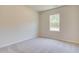 Well-lit bedroom featuring neutral walls and carpet at 262 Depot Landing Rd # 51, Auburn, GA 30011