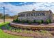 Brick community entrance sign for Auburn Station, landscaped at 262 Depot Landing Rd # 51, Auburn, GA 30011