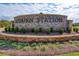 Auburn Station community entrance sign with brick and landscaping at 262 Depot Landing Rd, Auburn, GA 30011