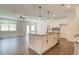 Open concept kitchen with island and access to backyard at 262 Depot Landing Rd, Auburn, GA 30011