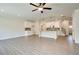 Open concept living room and kitchen with wood-look flooring at 262 Depot Landing Rd, Auburn, GA 30011