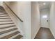 Modern staircase with dark wood risers and white treads at 262 Depot Landing Rd, Auburn, GA 30011