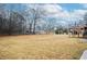 Large backyard with open space and mature trees at 2832 Fieldstone Se Dr, Conyers, GA 30013