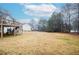 Large backyard with a deck and partial view of home at 2832 Fieldstone Se Dr, Conyers, GA 30013